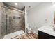 Modern bathroom with sleek tile shower, glass door, and contemporary vanity at 2730 River View Dr, Broomfield, CO 80023