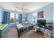 bedroom with light blue walls, gray carpet, natural light, and playful decor at 2730 River View Dr, Broomfield, CO 80023
