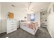 Bright bedroom with white walls, carpet flooring, and ample natural light from a large window at 2730 River View Dr, Broomfield, CO 80023
