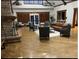 The clubhouse common area has stylish furniture and a stone fireplace at 2730 River View Dr, Broomfield, CO 80023