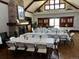 A clubhouse room is set up with tables and chairs for a large gathering at 2730 River View Dr, Broomfield, CO 80023