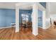 Open-concept dining room with hardwood floors and stylish lighting fixture, perfect for gatherings at 2730 River View Dr, Broomfield, CO 80023