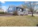 Charming home with a covered porch and well-maintained front lawn, situated in a friendly neighborhood at 2730 River View Dr, Broomfield, CO 80023