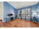 Bright living room featuring hardwood floors, vaulted ceiling, and large windows allowing ample natural light at 2730 River View Dr, Broomfield, CO 80023