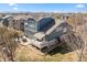 Back exterior of a home with a deck, patio, and landscaped yard offering great outdoor space at 2730 River View Dr, Broomfield, CO 80023