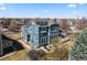 Rear exterior with a deck, patio, and solar panels, providing sustainable and outdoor living at 2730 River View Dr, Broomfield, CO 80023