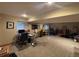 Spacious basement with multiple desks and room for activities at 6833 S Miller St, Littleton, CO 80127