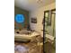 Bathroom has a soaking tub beneath a geometric window and a glass enclosed shower at 6833 S Miller St, Littleton, CO 80127