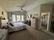 Bedroom with vaulted ceiling and an ensuite bathroom at 6833 S Miller St, Littleton, CO 80127