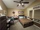 Charming bedroom featuring a unique ceiling fan and a cozy workspace at 6833 S Miller St, Littleton, CO 80127