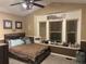 Cozy bedroom with a platform bed and decorative window accents at 6833 S Miller St, Littleton, CO 80127