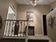 Upper hallway featuring neutral colors and decorative wall hangings at 6833 S Miller St, Littleton, CO 80127