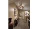 Inviting hallway with decorative mirror and vaulted ceiling at 6833 S Miller St, Littleton, CO 80127