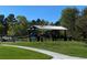 Neighborhood picnic area with a shaded pavilion, picnic tables, and lush green surroundings at 6833 S Miller St, Littleton, CO 80127