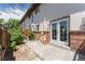 Backyard patio featuring a charming wooden fence with beautiful garden at 3608 W Radcliff Ave, Denver, CO 80236
