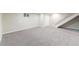 Spacious basement with new carpeting and a bright, open layout, ideal for recreation or storage at 3608 W Radcliff Ave, Denver, CO 80236