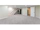 Finished basement with stairs, offers flexible living space for various needs at 3608 W Radcliff Ave, Denver, CO 80236