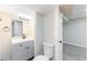 This bathroom has a modern vanity and sleek fixtures providing a refreshing space at 3608 W Radcliff Ave, Denver, CO 80236