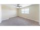 Bedroom with a ceiling fan, carpeted floor, neutral paint, and a window offering natural light at 3608 W Radcliff Ave, Denver, CO 80236