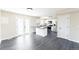 Contemporary kitchen featuring white cabinetry, and an island with stainless steel appliances at 3608 W Radcliff Ave, Denver, CO 80236