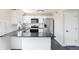 Well-appointed kitchen featuring white cabinets, modern appliances, and a functional layout at 3608 W Radcliff Ave, Denver, CO 80236