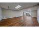 Finished basement area with wood floors and sliding glass doors leading to the backyard at 8225 S Cody St, Littleton, CO 80128