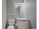Updated half bathroom with granite vanity and contemporary lighting at 8225 S Cody St, Littleton, CO 80128