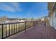 Wooden deck showcasing wooden railing overlooking backyard and neighborhood at 8225 S Cody St, Littleton, CO 80128