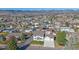 Inviting two-story home boasts a well-manicured lawn and an attached two-car garage at 8225 S Cody St, Littleton, CO 80128