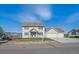 Charming two-story home with a well-maintained lawn and a convenient two-car garage at 8225 S Cody St, Littleton, CO 80128