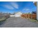 View of the detached garage and fenced in backyard at 8225 S Cody St, Littleton, CO 80128