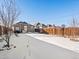 Large backyard with fence, snowy yard in winter at 402 Harrison Ave, Fort Lupton, CO 80621