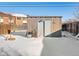 Backyard shed, in the winter snow at 402 Harrison Ave, Fort Lupton, CO 80621