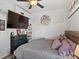 Bedroom with gray bedding and decorative wall art above the bed at 402 Harrison Ave, Fort Lupton, CO 80621