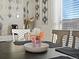 Close up of dining room table featuring modern decor and place settings at 402 Harrison Ave, Fort Lupton, CO 80621