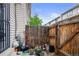 Fenced backyard with a view of a wooden fence and plants in pots at 17664 E Loyola Dr # C, Aurora, CO 80013