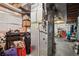 Unfinished basement showing the home's HVAC system, utility storage and concrete floors at 17664 E Loyola Dr # C, Aurora, CO 80013