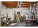 Home gym in unfinished basement features exercise bike, free weights, and a weight training station at 17664 E Loyola Dr # C, Aurora, CO 80013