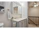 Powder blue vanity features traditional hardware, a mirrored medicine cabinet and neutral countertop at 17664 E Loyola Dr # C, Aurora, CO 80013