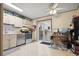 Bright kitchen with stainless appliances, light countertops, tile floors, and patio door at 17664 E Loyola Dr # C, Aurora, CO 80013