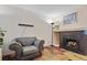 Cozy living room with fireplace, plush seating and decorative fireplace at 17664 E Loyola Dr # C, Aurora, CO 80013