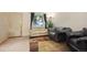 Inviting living room with neutral tones, a cozy seating area, and a large window at 17664 E Loyola Dr # C, Aurora, CO 80013
