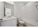 Bathroom featuring a tub and shower combo with tile surround and a vanity with sink at 1374 Penner Dr, Erie, CO 80026