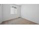 A neutral bedroom with a window that allows natural light to fill the space at 1374 Penner Dr, Erie, CO 80026