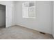 Bedroom with a closet, a window, and soft neutral carpet at 1374 Penner Dr, Erie, CO 80026