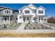 Charming new two-story home with a landscaped yard and inviting front porch at 1374 Penner Dr, Erie, CO 80026