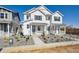 New construction two-story home with gravel landscaping and covered porch at 1374 Penner Dr, Erie, CO 80026