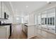 Bright kitchen featuring stainless steel appliances, hardwood floors, and a center island at 1374 Penner Dr, Erie, CO 80026