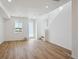 Bright living room with hardwood floors and large windows at 1374 Penner Dr, Erie, CO 80026