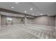 Large finished basement with recessed lighting and neutral carpeting at 17223 W 84Th Dr, Arvada, CO 80007